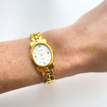 Load image into Gallery viewer, Vintage 1990s Gold-Plated Ladies&#39; Nina Ricci Quartz Watch with Oval Mother of Pearl Dial
