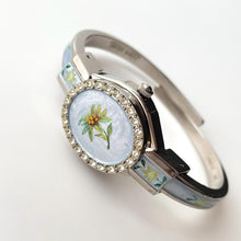 Load image into Gallery viewer, Vintage André Mouche Quartz Watch with Light Blue Enamel Floral Design, Concealed Dial and Silver-Tone Bangle Bracelet
