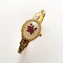 Load image into Gallery viewer, Vintage André Mouche Quartz Watch with Enamel Floral Design, Concealed Dial and Gold-Plated Bangle Bracelet
