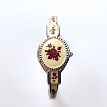 Load image into Gallery viewer, Vintage André Mouche Quartz Watch with Burgundy Enamel Floral Design, Concealed Dial and Silver-Tone Bangle Bracelet
