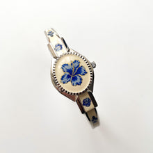 Load image into Gallery viewer, Vintage André Mouche Quartz Watch with Beige and Blue Enamel Floral Design, Concealed Dial and Stainless Steel Bangle Bracelet
