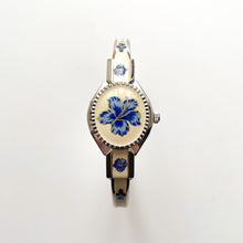 Load image into Gallery viewer, Vintage André Mouche Quartz Watch with Beige and Blue Enamel Floral Design, Concealed Dial and Stainless Steel Bangle Bracelet
