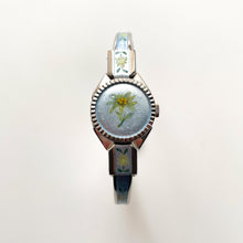 Load image into Gallery viewer, Vintage 1998 André Mouche Quartz Watch with Light Blue Enamel Floral Design, Concealed Dial and Silver-Tone Bangle Bracelet
