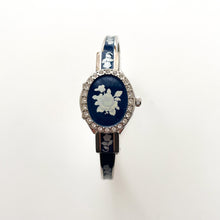 Load image into Gallery viewer, Vintage André Mouche Quartz Watch with Navy Enamel Floral Design, Concealed Dial and Silver-Tone Bangle Bracelet
