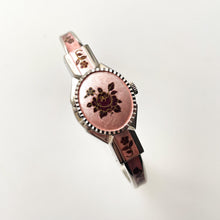 Load image into Gallery viewer, Vintage 1990s André Mouche Quartz Watch with Pink &amp; Burgundy Enamel Floral Design, Concealed Dial and Silver-Tone Bangle Bracelet
