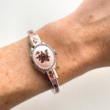 Load image into Gallery viewer, Vintage 1990s André Mouche Quartz Watch with Pink &amp; Burgundy Enamel Floral Design, Concealed Dial and Silver-Tone Bangle Bracelet
