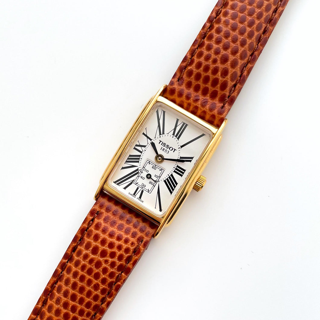 Ladies' Vintage Gold-Plated Tissot Quartz Watch with Rectangular Tank Dial and Brown Leather Strap