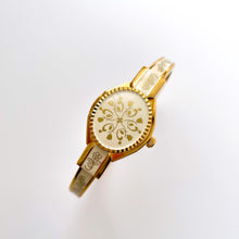 Load image into Gallery viewer, Vintage André Mouche Quartz Watch with Enamel Floral Design, Concealed Dial and Gold-Plated Bangle Bracelet
