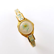 Load image into Gallery viewer, Vintage 1999 André Mouche Quartz Watch with Enamel Floral Design, Concealed Dial and Gold-Plated Bangle Bracelet
