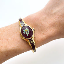 Load image into Gallery viewer, Vintage André Mouche Quartz Watch with Burgundy Enamel Floral Design, Concealead Dial and Gold-Plated Bangle Bracelet
