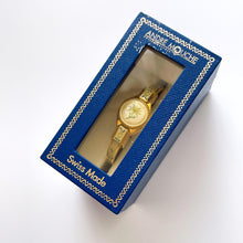 Load image into Gallery viewer, Vintage 1999 André Mouche Quartz Watch with Enamel Floral Design, Concealed Dial and Gold-Plated Bangle Bracelet
