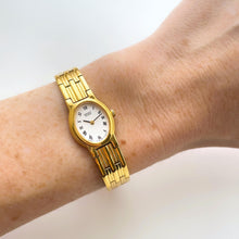 Load image into Gallery viewer, Vintage 1990s Gold-Plated Ladies&#39; Seiko Quartz Watch with White Oval Dial and Roman Numerals
