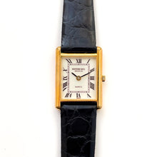 Load image into Gallery viewer, Vintage Tank-Style Gold-Plated Raymond Weil Quartz Watch with Black Leather Strap
