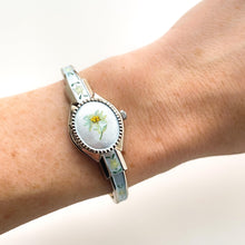 Load image into Gallery viewer, Vintage 1990s André Mouche Quartz Watch with Light Blue Enamel Floral Design, Concealed Dial and Silver-Tone Bangle Bracelet
