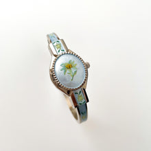 Load image into Gallery viewer, Vintage 1990s André Mouche Quartz Watch with Light Blue Enamel Floral Design, Concealed Dial and Silver-Tone Bangle Bracelet
