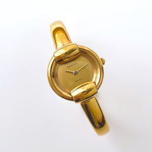 Load image into Gallery viewer, 90s Gold-Plated Gucci 1400L Bangle Quartz Watch with Horsebit Design
