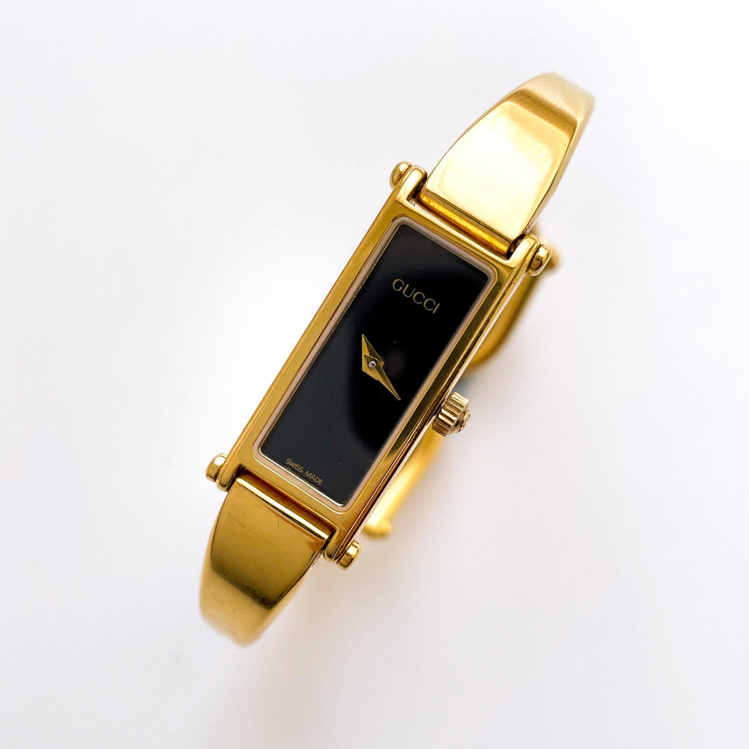 Vintage Ladies' Gold-Plated Gucci 1500L Bangle Quartz Watch with Black Rectangular Dial - Boxed