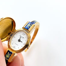 Load image into Gallery viewer, Vintage R. Müller Quartz Watch with Blue Enamel Floral Design, Concealed Dial and Gold-Plated Bangle Bracelet
