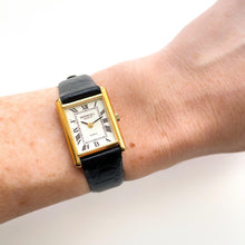 Load image into Gallery viewer, Vintage Tank-Style Gold-Plated Raymond Weil Quartz Watch with Black Leather Strap
