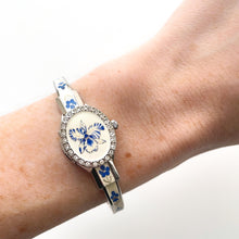 Load image into Gallery viewer, Vintage André Mouche Quartz Watch with Blue Enamel Floral Design, Concealed Dial and Silver-Tone Bangle Bracelet
