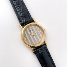 Load image into Gallery viewer, Vintage Gold-Plated Ladies&#39; Seiko Quartz Watch with Striped Dial and Black Leather Strap
