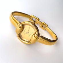 Load image into Gallery viewer, 90s Gold-Plated Gucci 1400L Bangle Quartz Watch with Horsebit Design
