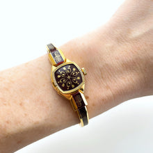 Load image into Gallery viewer, Vintage André Mouche Quartz Watch with Burgundy Enamel Floral Design, Concealead Dial and Gold-Plated Bangle Bracelet
