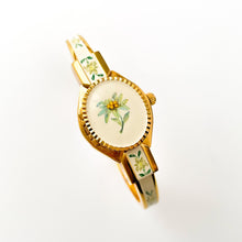 Load image into Gallery viewer, Vintage André Mouche Quartz Watch with Enamel Floral Design, Concealed Dial and Gold-Plated Bangle Bracelet
