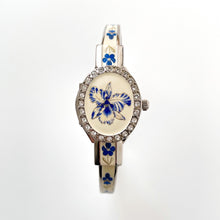 Load image into Gallery viewer, Vintage André Mouche Quartz Watch with Blue Enamel Floral Design, Concealed Dial and Silver-Tone Bangle Bracelet
