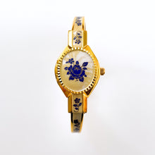 Load image into Gallery viewer, Vintage 00s André Mouche Quartz Watch with Beige and Blue Enamel Floral Design, Concealed Dial and Gold-Plated Bangle Bracelet - Boxed
