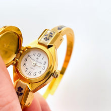 Load image into Gallery viewer, Vintage 00s André Mouche Quartz Watch with Beige and Blue Enamel Floral Design, Concealed Dial and Gold-Plated Bangle Bracelet - Boxed
