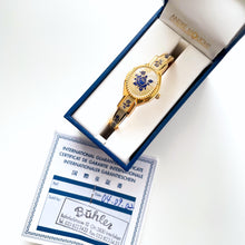 Load image into Gallery viewer, Vintage 00s André Mouche Quartz Watch with Beige and Blue Enamel Floral Design, Concealed Dial and Gold-Plated Bangle Bracelet - Boxed
