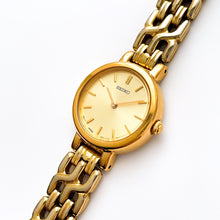 Load image into Gallery viewer, Vintage 1990s Gold-Plated Ladies&#39; Seiko Quartz Watch with Round Dial and Intricate Bracelet
