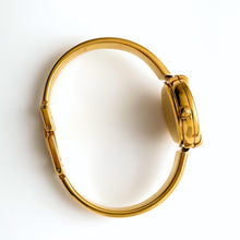 Load image into Gallery viewer, 90s Gold-Plated Gucci 1400L Bangle Quartz Watch with Horsebit Design and White Dial
