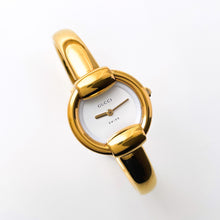 Load image into Gallery viewer, 90s Gold-Plated Gucci 1400L Bangle Quartz Watch with Horsebit Design and White Dial
