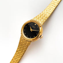 Load image into Gallery viewer, Vintage 1990s Ladies&#39; Gold-Plated Seiko Quartz Watch with Black Dial and Integrated Bracelet
