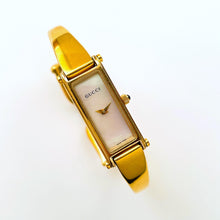 Load image into Gallery viewer, Vintage 1990s Ladies&#39; Gold-Plated Gucci 1500L Bangle Quartz Watch with Rectangular Mother of Pearl Dial
