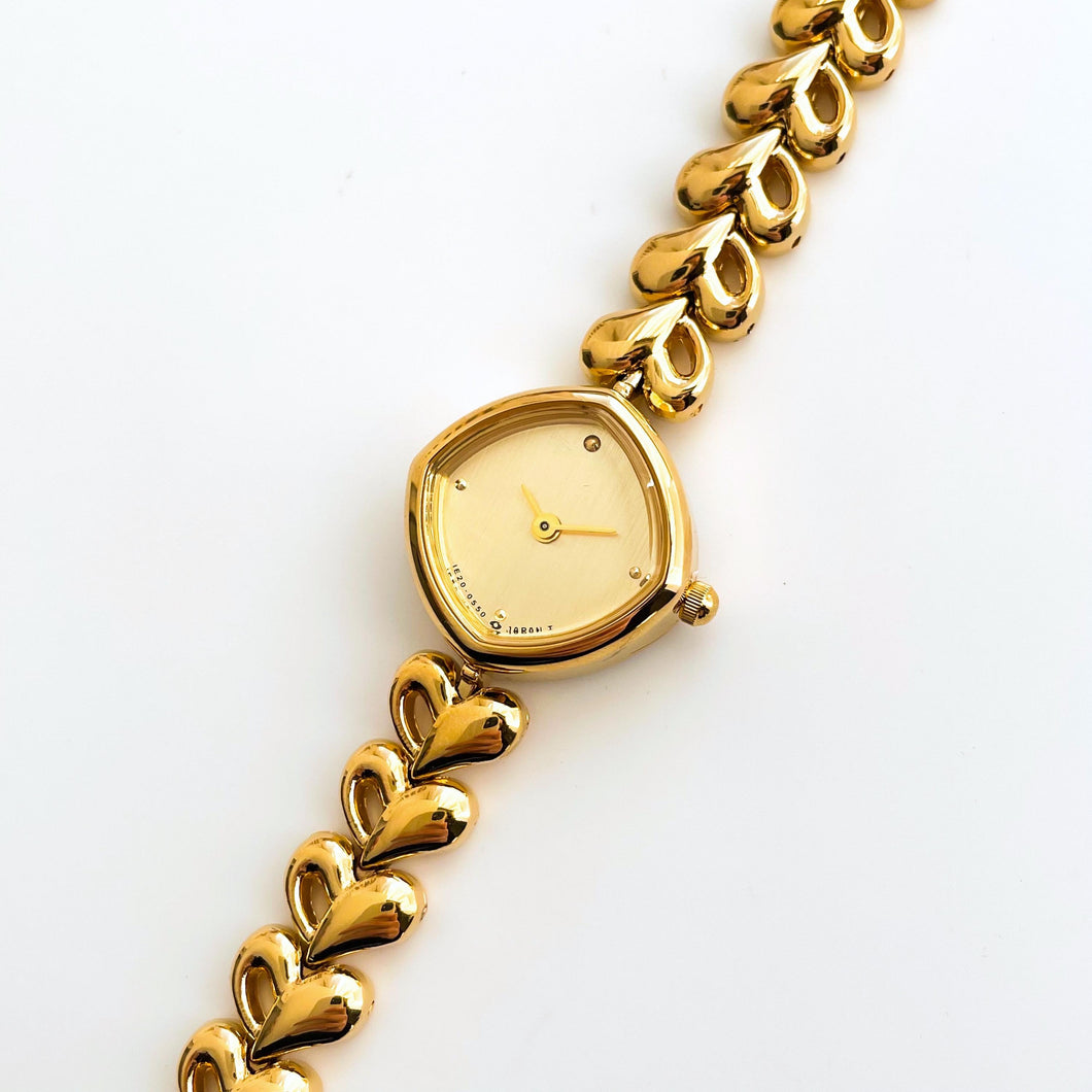 Dainty Ladies' Gold-Plated Quartz Watch with Heart Pattern Bracelet