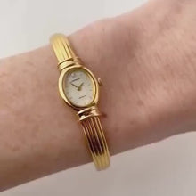 Load and play video in Gallery viewer, Very Rare 1995 Gold-Plated Lassale (Seiko) Articulated Bangle Quartz Watch with Mother of Pearl Dial
