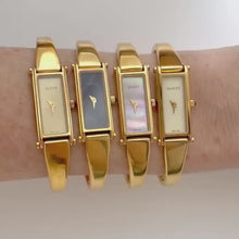 Load and play video in Gallery viewer, Vintage 1998 Ladies&#39; Gold-Plated Gucci 1500L Bangle Quartz Watch with Rectangular Mother of Pearl Dial
