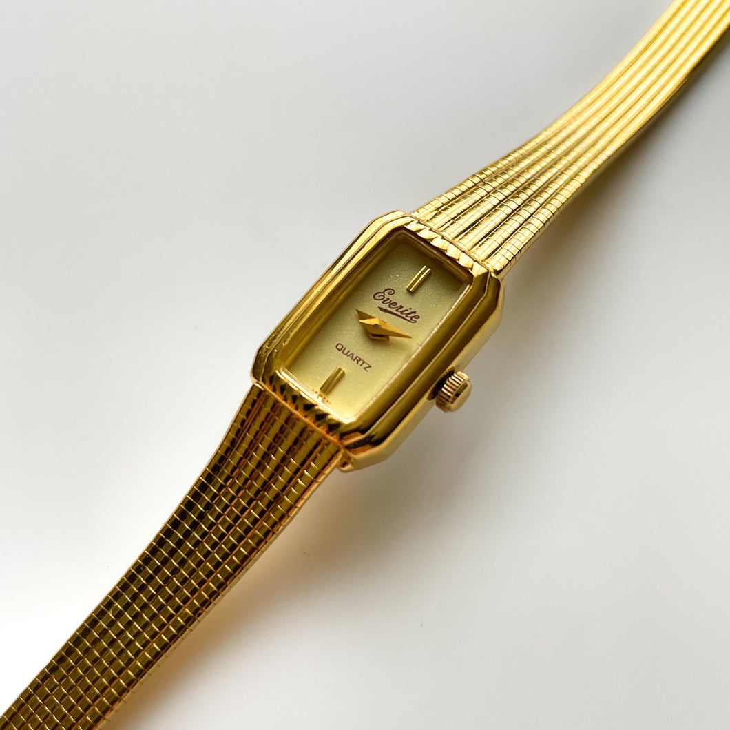 Tiny Ladies' Gold-Tone Everite Quartz Watch with Rectangular Dial