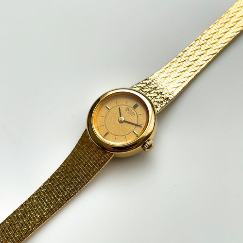 1990 Ladies' Gold-Tone Seiko Quartz Watch with Round Dial