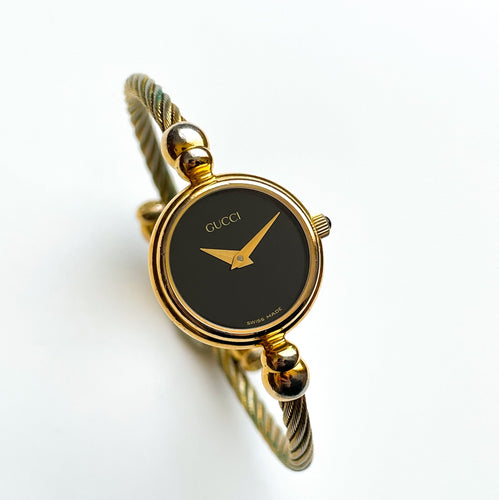 Vintage Ladies' Gold-Tone Gucci Bangle Quartz Watch with Black Dial