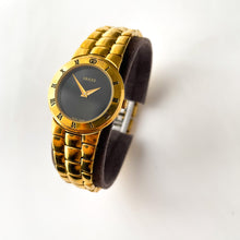 Load image into Gallery viewer, Vintage Gold-Plated Gucci Quartz Watch with Black Dial and Roman Numerals
