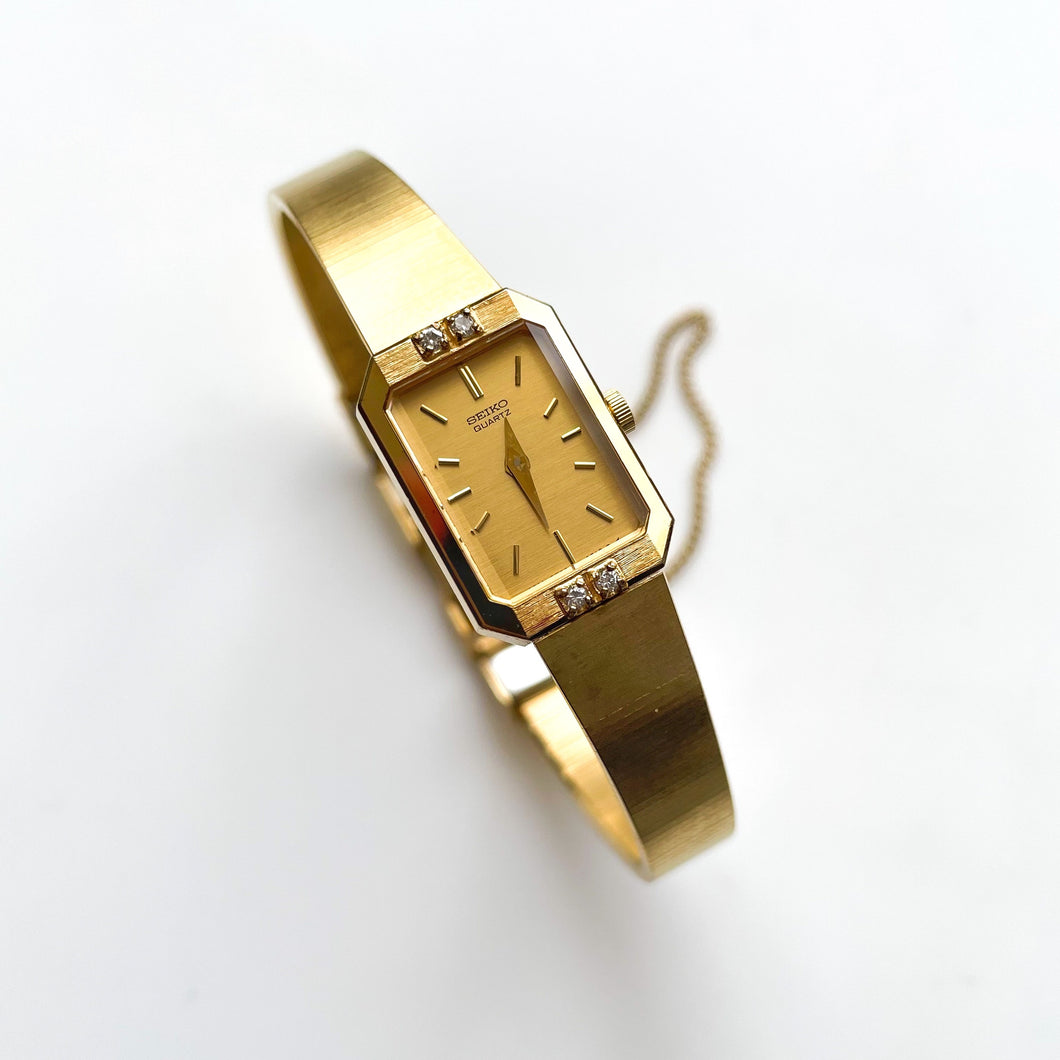 Ladies' 1990s Rectangular Seiko Quartz Watch With Gold-Plated Case and 4 Diamonds