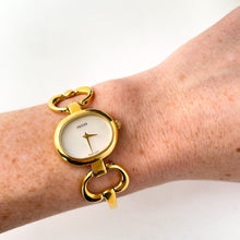 Load image into Gallery viewer, 1990s Gucci Quartz Watch with Mother of Pearl Dial and Semi Bangle Bracelet
