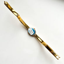 Load image into Gallery viewer, Very Rare 1990s Gold-Plated Lassale (Seiko) Articulated Bangle Quartz Watch with Mother of Pearl Dial and Diamond-Set Bezel
