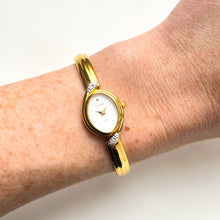 Load image into Gallery viewer, Very Rare 1990s Gold-Plated Lassale (Seiko) Articulated Bangle Quartz Watch with Mother of Pearl Dial and Diamond-Set Bezel
