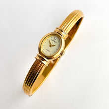 Load image into Gallery viewer, Very Rare 1995 Gold-Plated Lassale (Seiko) Articulated Bangle Quartz Watch with Mother of Pearl Dial
