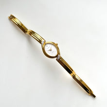 Load image into Gallery viewer, Very Rare 1990s Gold-Plated Lassale (Seiko) Articulated Bangle Quartz Watch with Mother of Pearl Dial and Diamond-Set Bezel
